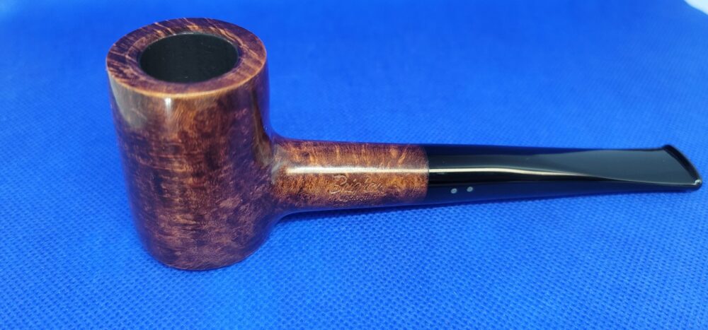 Quality smoking pipe on a blue background.