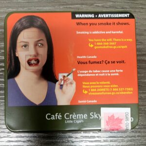 A single Café Crème Sky Cigarillo with a natural wrapper and smooth draw.