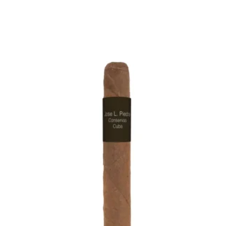 A Jose L. Piedra Cremas cigar displayed on a rustic wooden surface, showcasing its smooth, medium-brown wrapper and iconic band. The cigar reflects traditional Cuban craftsmanship, offering an approachable and affordable choice for smokers.