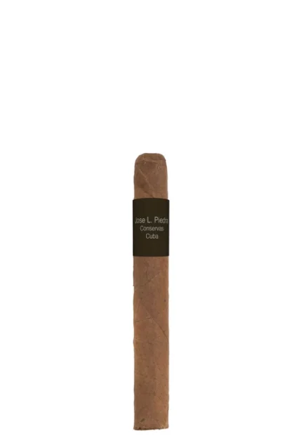 A Jose L. Piedra Cremas cigar displayed on a rustic wooden surface, showcasing its smooth, medium-brown wrapper and iconic band. The cigar reflects traditional Cuban craftsmanship, offering an approachable and affordable choice for smokers.