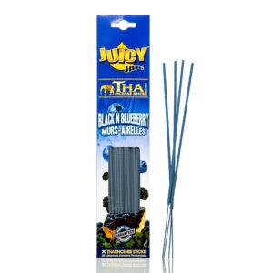 Close-up of Juicy Jay Black N Blueberry incense sticks burning, with smoke swirling.