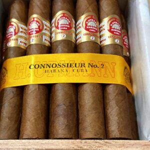 A luxurious wooden box of H. Upmann Connoisseurs No. 2 cigars, neatly arranged with each cigar showcasing its signature Cuban craftsmanship. The box features the iconic H. Upmann branding, with a golden seal and elegant presentation, emphasizing its premium quality.