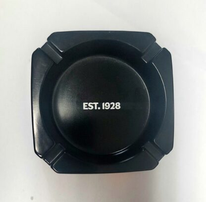 op view of Export A Black Ashtray showing circular grooves and deep center bowl for ash collection.